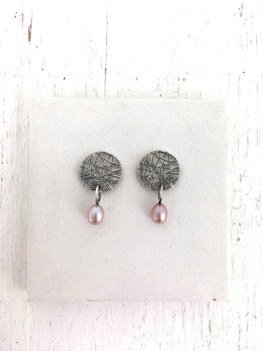 Boucles d'oreilles rondes avec perle en argent